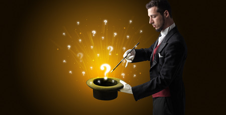 Magician conjure question signs from a cylinder