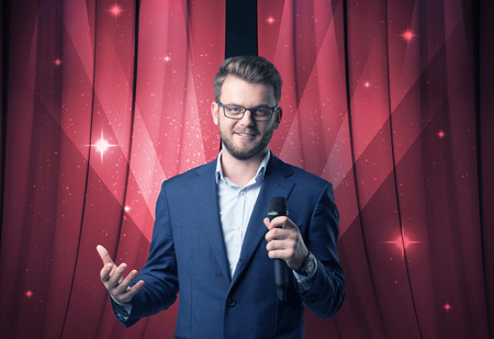 Businessman holding microphoneの写真素材