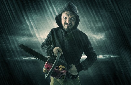 Poacher in mysterious rainy weather conceptの写真素材