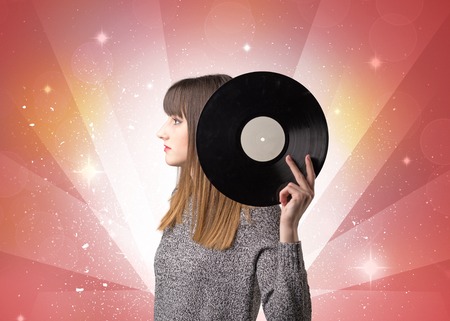 Lady holding vinyl recordの写真素材