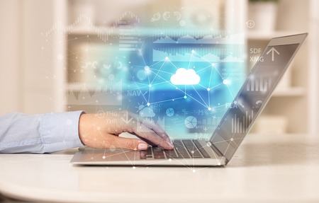 Business woman working on laptop with cloud technology conceptの写真素材