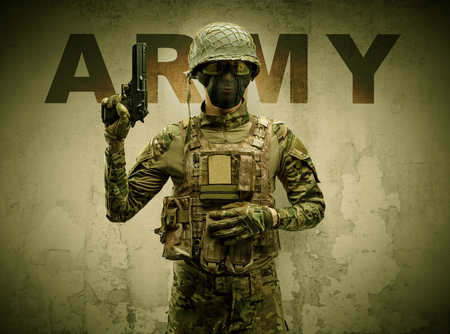 Armed soldier with damaged wall background
