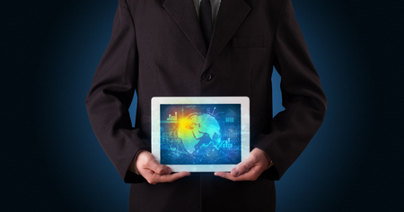 holding tablet with global databaseの写真素材