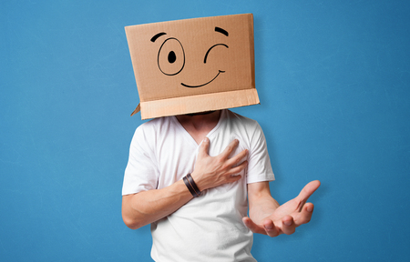 Man with smiling carton box headの写真素材