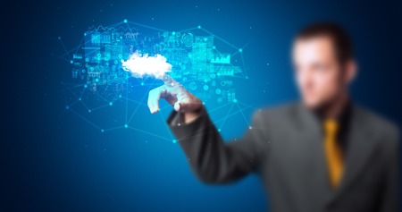 Man touching cloud system hologramの写真素材