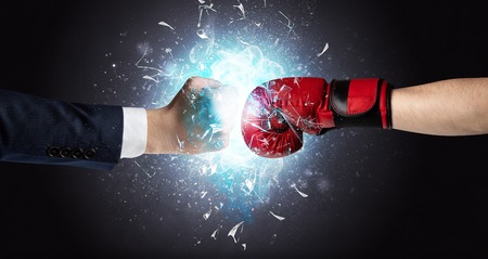 Fighting hands breaking glass