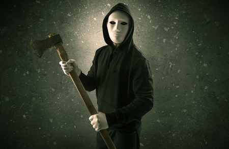 Armed villain in an empty dark roomの写真素材