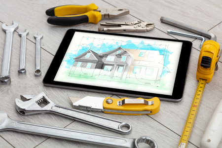 Tablet and tools with house plan conceptの写真素材