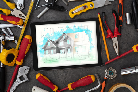 Tablet and tools with house plan concept