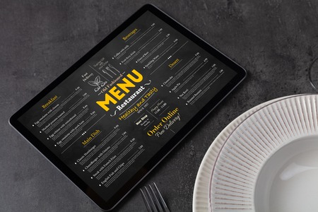 Tableware with online menu on tabletの写真素材