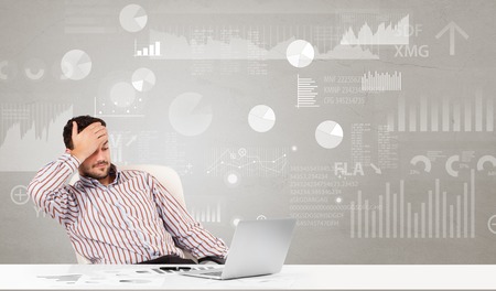Business person sitting at desk with financial change, and report diagram conceptの写真素材
