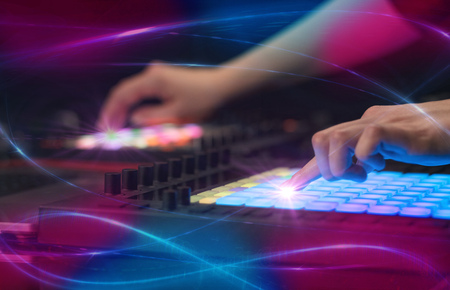 Hand mixing music on midi controller with wave vibe concept