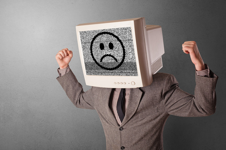 Young person with monitor head, old school smile conceptの写真素材