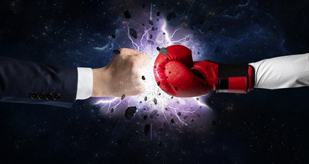 Two hands fighting with storm explosion conceptの写真素材