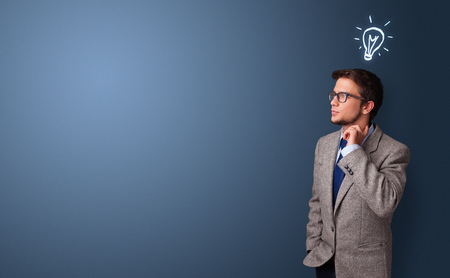 Young person looking for new idea with lighting bulb conceptの写真素材