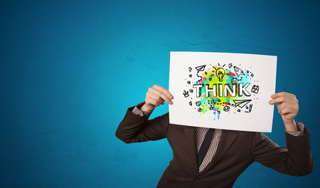 Young person holding paper with design thinking conceptの写真素材