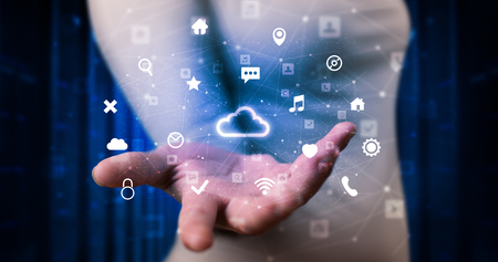 Person holding hologram screen displaying information from cloud technologyの写真素材