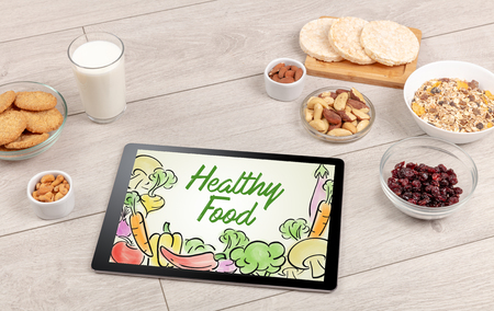 Healthy food composition with tabletの写真素材