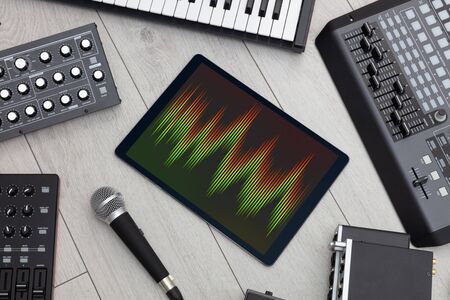 Recording music with tablet and electronic music instrumentsの写真素材