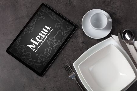 Tablet with online order concept on a lain tableの写真素材