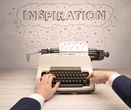 First person perspective hand writing on typewriter with cloud message conceptの写真素材