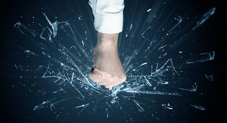 Big hand hits intense and breaks glassesの写真素材