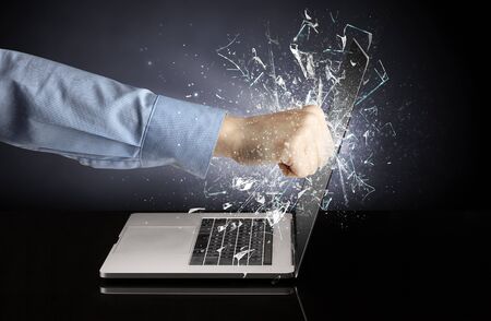 Hand hitting strongly laptop screen glassの写真素材