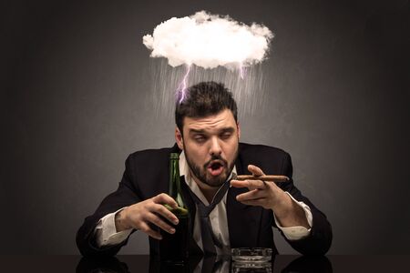 Young drunk disappointed man with hard time overcast conceptの写真素材