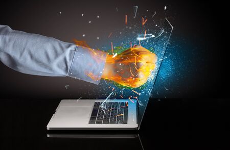 Firing hand hitting strongly laptop screen glassの写真素材