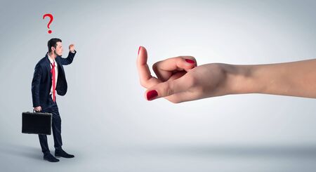 Businessman in an affair with kisses on his face and question conceptの写真素材