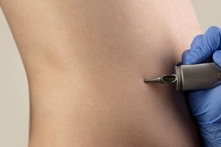 Hand preparing to make a new tattooの写真素材