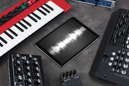 Recording music with tablet and electronic music instrumentsの写真素材