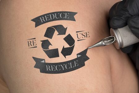 Hand tattooing recycle for a better environment concept on naked clear skinの写真素材