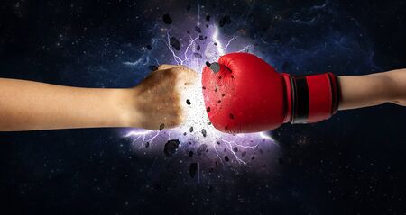 Two hands fighting with storm explosion concept