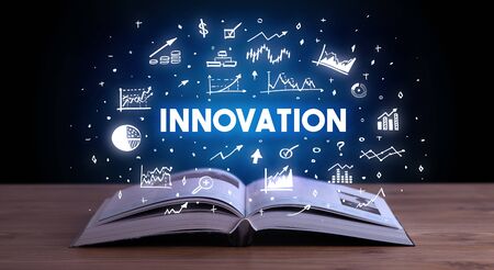 INNOVATION inscription coming out from an open book, business conceptの写真素材