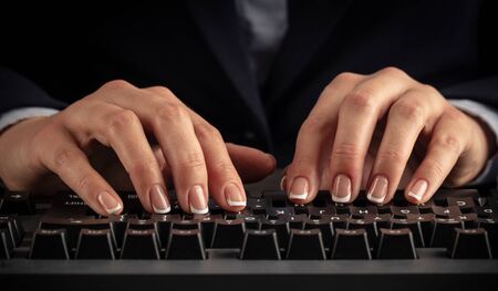 Business woman typing on keyboardの写真素材