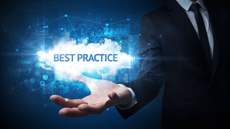 Hand of Businessman holding BEST PRACTICE inscription, successful business conceptの写真素材