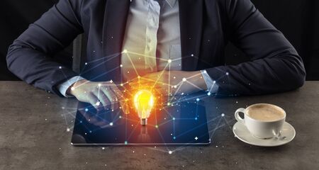 Business woman working on tablet with new idea and network conceptの写真素材
