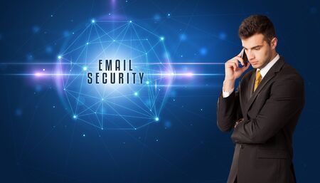 Businessman thinking about security solutions with EMAIL SECURITY inscriptionの写真素材