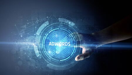 Hand touching ADWORDS button, modern business technology conceptの写真素材