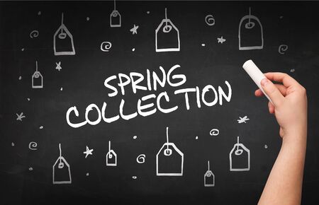 Hand drawing  SPRING COLLECTION inscription with white chalk on blackboard, online shopping conceptの写真素材
