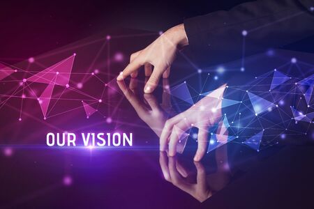 Businessman touching huge screen with OUR VISION  inscription, modern technology business conceptの写真素材