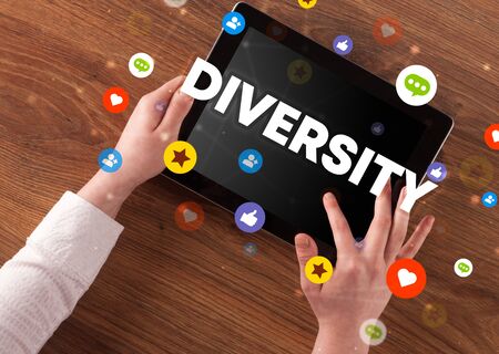 Close-up of a touchscreen with DIVERSITY  inscription, social networking conceptの写真素材