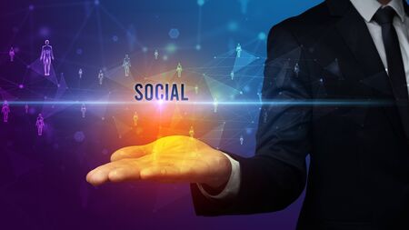 Elegant hand holding SOCIAL inscription, social networking conceptの写真素材