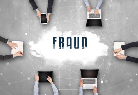 Group of people having a meeting with FRAUD  insciption, web security concept