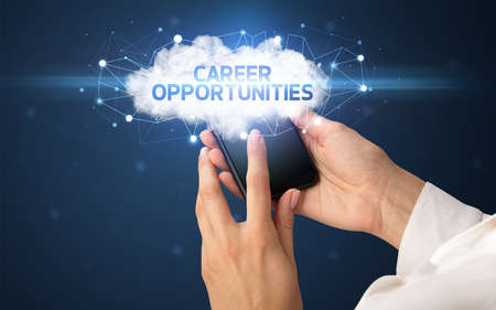 Female hand touching smartphone with CAREER OPPORTUNITIES inscription, cloud business concept