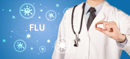 Doctor giving pill with FLU  inscription, coronavirus concept