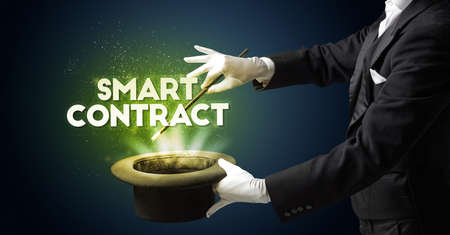 Illusionist is showing magic trick with SMART CONTRACT inscription, new business model concept