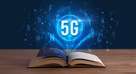 5G inscription coming out from an open book, digital technology conceptの写真素材