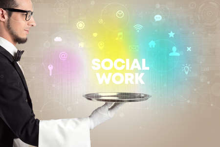 Waiter serving social networking with SOCIAL WORK inscription, new media conceptの写真素材